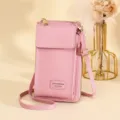 Roze crossbody telefoontasje met litchi-textuur en een verstelbare schouderriem - Roze