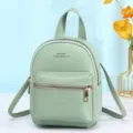 Mini zaino a tracolla verde menta alla moda con una elegante trama in ecopelle - Verde