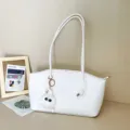 Stylish white crocodile pattern tote bag for women featuring a cute fluffy monster charm. - White