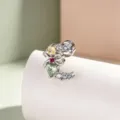Elegant silver titanium cartilage stud featuring multi-colored cubic zirconia and a bow detail - Titanium Alloy External Spiral / Mint Green Moon