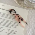 Detailed macro shot of a small tortoiseshell acetate fish-shaped hair pin for elegant buns - Light Leopard - Large