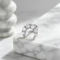 Macro view of elegant silver crescent moon ear stud set with sparkling white zirconia stones - Moon Style (A-1031) / Stainless Steel External Spiral / White