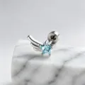 Detailed close-up of the star-shaped blue zircon earring with silver wing design element - Right Side Style (A-1005) / Stainless Steel External Spiral / Light Sea Blue