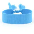 Close-up of sky blue woven fabric ribbon bracelet with decorative tassels - Sky Blue (B248)