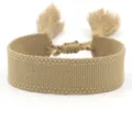 Detailed macro view of khaki solid color woven bracelet with fringe tassels for DIY embroidery - Khaki (B175)