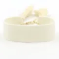 Detailed view of cream-white woven fabric bracelet with tassels for DIY embroidery projects - Cream White (B196)