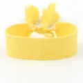 Handmade plain yellow woven fabric wristband featuring braided tassel closure for DIY - Yellow (B132)