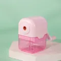 Pink manual pencil sharpener with crank handle and transparent shavings box detail view - Pink
