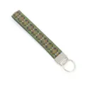 Detailed macro view of an ethnic style green woven lanyard keychain with geometric diamond pattern - Multicolor Geometric Rhombus Pattern