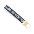Close-up of ethnic woven lanyard keychain with black and white geometric pattern - Black and White Geometric Pattern