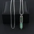 Detail view of stainless steel hollow flower aromatherapy diffuser pendant necklace - Jade