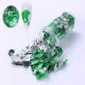 Shiny green and silver nail art foil flakes stored in a transparent jar for manicure - Green and Silver