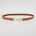 Brown patent leather thin belt detail, stylish golden metal buckle, elegant women accessory. - Polished Camel