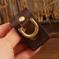Handmade genuine leather belt loop key holder detail, featuring golden d-ring and secure snap. - Coffee