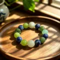 Natural fluorite crystal beaded bracelet with multi-colored gemstone beads on wood tray. - Style 3
