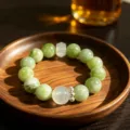 Natural green fluorite crystal beaded bracelet with elegant wooden tray presentation scene - Style 4