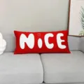 Red long bolster throw pillow detail, decorative cushion with white NICE letter print on sofa. - DAJS03 / 50x30 cm (Without Insert)
