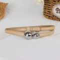 Detailed view of women's thin leather belt with silver double ball buckle fashion waist accessory. - Apricot with Silver Buckle