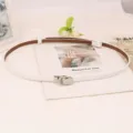 Stylish thin white leather belt for women featuring elegant metal buckle minimalist design. - White Silver Buckle