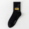 Black long sports cotton socks for teenagers and students with stylish typography letters. - One Size Loose Socks (Sizes 37-44) / Black 1