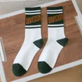 Men white and green athletic crew socks with division text and striped pattern for sport and daily. - One Size (Sizes 36-44) Individual Packaging / Color 1