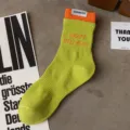 Men's green cotton mid-tube socks with orange cuff and side label, casual sports crew socks. - Men's One Size (Sizes 37-44) / Matcha Green