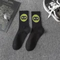 Streetwear cotton mid-tube socks for men and women, black with cool green robot graphic design. - Robot One Size / Size 4