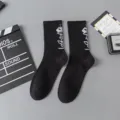 Streetwear cotton mid-tube socks for men and women, featuring a cool robot pattern in black. - Robot One Size / Size 11