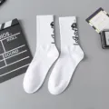 White mid-tube streetwear cotton socks with black graphic print for men and women, casual skate socks. - Robot One Size / Size 13