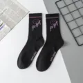 Black mid-calf streetwear socks with purple robot knit design, comfortable cotton casual wear. - Robot One Size / Size 15