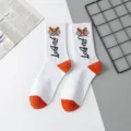 White cotton mid-tube socks with orange heel and toe, featuring trendy street robot print. - Robot One Size / Size 16