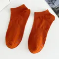 Women's solid orange low-cut boat socks with anti-slip grips, casual cotton short socks. - Women's One Size (Individual Tag, EU 36-41) / Pumpkin