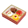 Detailed close-up of the miniature Christmas resin dessert set with Santa ornament - Red and Gold Border Christmas Set