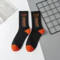 Street style cotton mid-tube socks for men and women, black with orange robot pattern and toe. - Robot One Size / Size 18