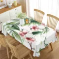 Detail view of waterproof rectangular tablecloth with summer green leaves and pink floral design. - Style 6