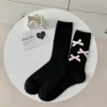 Cute black mid-calf socks for women featuring sweet pink bows, perfect for Lolita style. - One Size / Black With Pink Bow