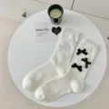 White ribbed mid-tube socks for women featuring cute black bows, sweet Japanese style hosiery. - One Size / White With Black Bow