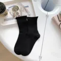Classic black cotton crew socks with a cozy rolled top design, perfect for daily wear. - One Size / Black