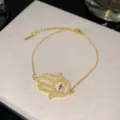 Bracelet Main de Hamsa en acier titane doré avec zircons et œil protecteur - Style Centre Bleu 5 (Style 5)