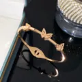 Rose gold titanium steel butterfly bangle with frosted cut-out design details - Rose Gold - Three Butterfly Bangle