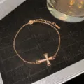 Elegant rose gold cross bracelet featuring shimmering crystals on black velvet display - Rose Gold Hollow Rhinestone Cross Style (Style 25)