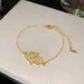 Bracelet Hamsa élégant en acier inoxydable plaqué or incrusté de zircone cubique - Style Strass Clair 6 (Style 6)