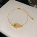 Élégant bracelet main de Fatma en acier titane doré avec zircon bleu mauvais œil - Style Centre Bleu Foncé 9 (Style 9)