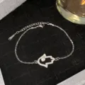 Bracelet en acier titane argenté avec main de Hamsa et design en zircon brillant - Style de main argentée avec diamant clair (Style 15)
