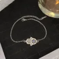 Élégant bracelet main de Fatma argenté avec œil bleu maléfique et zircons étincelants - Style hexagramme argenté œil bleu (Style 17)