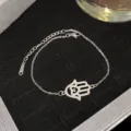 Bracelet en acier inoxydable argenté avec main de Hamsa, oxydes de zirconium et œil - Style mauvais œil avec diamant bleu argenté (Style 19)