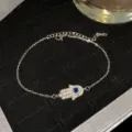 Bracelet main de Hamsa argenté avec cristaux étincelants et œil bleu maléfique - Style Hamsa Œil Bleu Foncé Argenté (Style 23)
