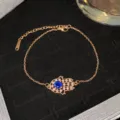 Bracelet main de Fatma en or rose avec zircon bleu central et cristaux étincelants - Style Œil Bleu Or Rose 33 (Style 33)