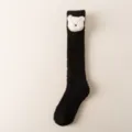 Chaussettes hautes duveteuses noires avec peluche d'ours blanc, chaudes pour l'hiver et la maison. - Taille unique / Tête d'ours - noir