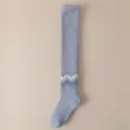 Soft coral fleece over-the-knee winter socks in light blue with wave pattern for women. - One Size / Blue